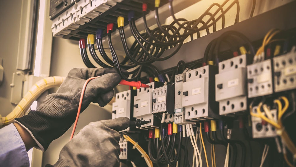 close up,hand,of,electrical,engineering,using,measuring,equipment,tool,to
